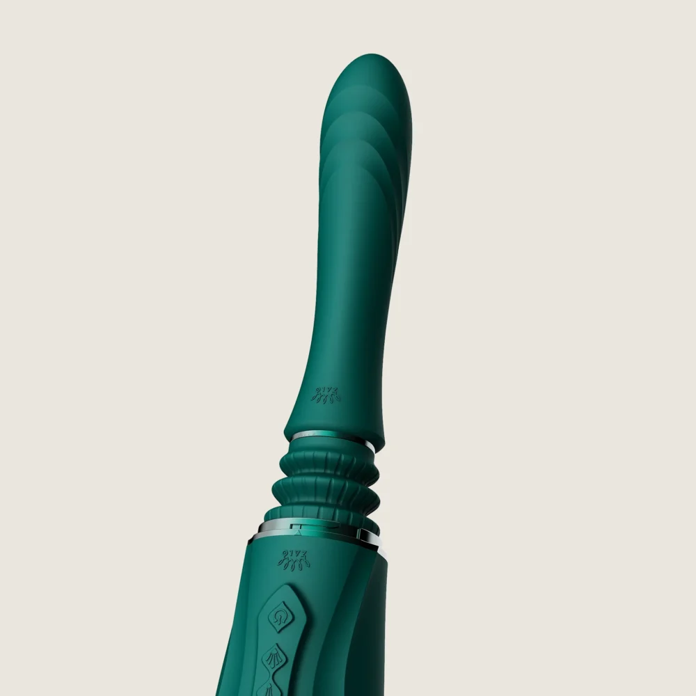 ZALO® Sesh Compact Sex Machine equipped with two replaceable vibrating massage sticks in Turqoise Green color.