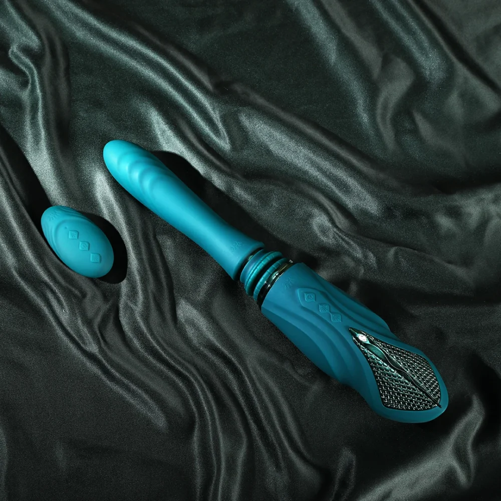 ZALO® Sesh Compact Sex Machine equipped with two replaceable vibrating massage sticks in Turqoise Green color.