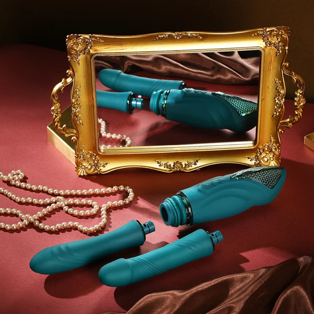 ZALO® Sesh Compact Sex Machine equipped with two replaceable vibrating massage sticks in Turqoise Green color.